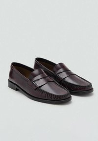Pair of polished dark burgundy leather loafers with moc toe stitching and a strap detail, displayed on a light gray background.