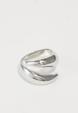 Silver ring with a twisted design, featuring a polished, reflective surface and smooth, rounded edges. No visible patterns or accents.