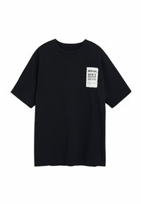 Black cotton t-shirt with a crew neck and short sleeves. Front pocket features a printed design with white text and a torn-edge detail.