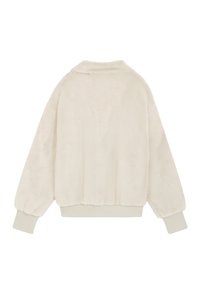 Light cream faux fur jacket with a relaxed fit. Features a soft texture, ribbed cuffs, and a subtle collar. No visible hardware or patterns.