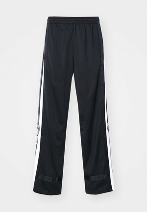 Black athletic pants with white side stripes, elastic waistband, and mesh fabric panels along the sides. Smooth texture and straight fit.
