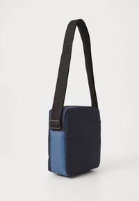 Tommy Jeans DAILY REPORTER UNISEX - Cross body bag - blue