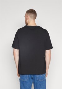 Tommy Hilfiger CORE STRETCH SLIM TEE - Basic T-shirt - black
