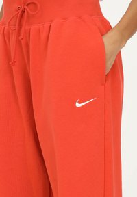 Nike Sportswear W PHNX FLC HR OS - Calças de fato de treino - orange