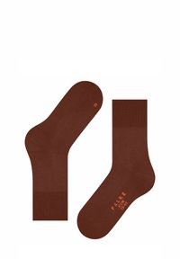 Chaussettes en coton marron avec une texture lisse, des poignets côtelés et une marque orange imprimée. Une chaussette marquée "R" pour indiquer l'orientation du pied droit.