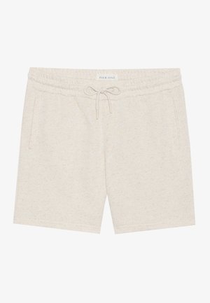 Shorts beige clair en matériau doux, dotés d'une taille à cordon de serrage, de poches latérales et d'une texture légèrement mouchetée.