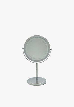 Miroir de table rond avec finition chromée sur une base circulaire, doté d'une surface lisse et réfléchissante ainsi que d'un bras pivotant pour un angle réglable.