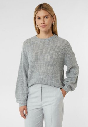 Light gray knitted sweater with a round neckline, relaxed fit, and long sleeves. The texture is soft with a subtle ribbed pattern.