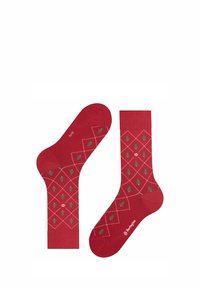Czerwone skarpetki z wzorem w diamenty, ozdobione zielonymi choinkami i białymi akcentami. Wykonane z miękkiego, elastycznego materiału.