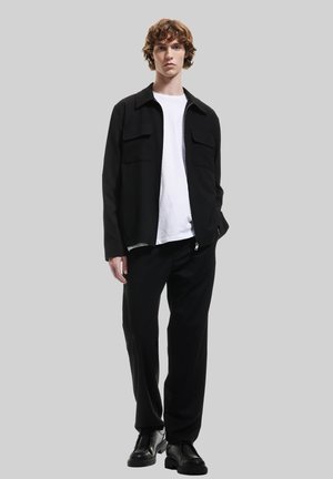 CLASSIC - Tygbyxor - black