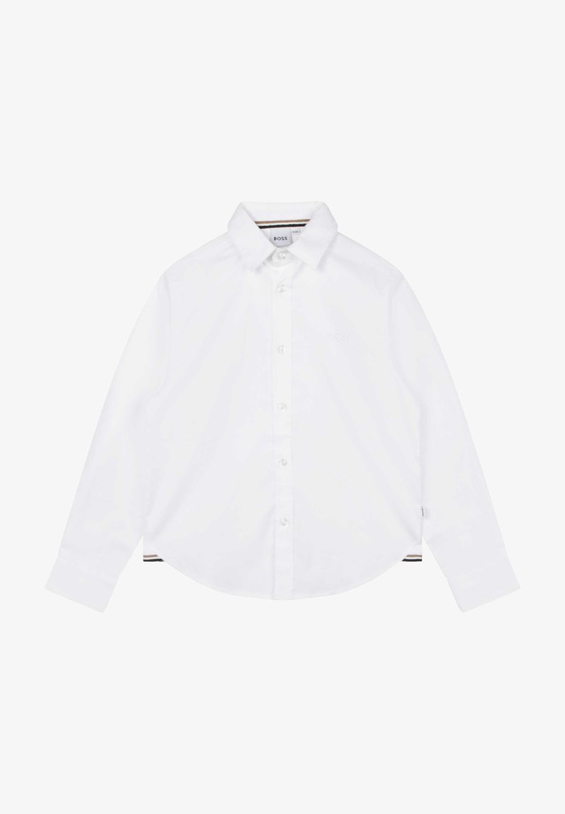 Camicia bianca a maniche lunghe in cotone. Presenta un colletto con bottoni, chiusura anteriore con bottoni e un discreto logo del brand. Vestibilità su misura.