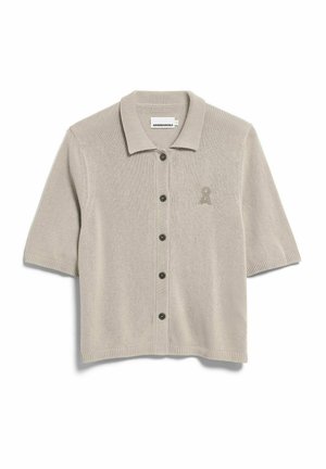 Light beige short-sleeve knit cardigan with six dark buttons, ribbed collar and cuffs, and small embroidered logo on the left chest.
