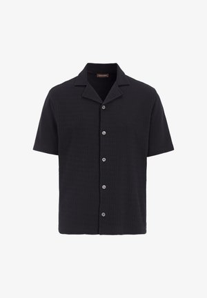 Schwarzes Kurzarmhemd aus strukturiertem Stoff, mit Knopfleiste und einem kragenförmigen Ausschnitt. Glatte Knöpfe und ordentlich verarbeitete Kanten.