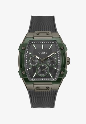 Green and black watch with a hexagonal shape, textured black rubber strap, three sub-dials, and prominent hour markers. Metal casing accents.