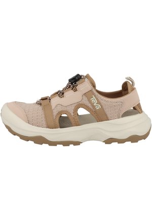 Beige Sportsandalen mit Mesh-Obermaterial, verstellbarer Bungee-Schnürung und einer dicken weißen Sohle. Enthält Aussparungen und verstärkte Akzente.
