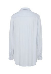 Light blue long-sleeve shirt with a button-up collar, smooth texture, and a relaxed fit; features rolled-up sleeves with button closures.