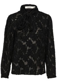Blusa nera trasparente con motivo floreale testurizzato, colletto alto e chiusura con lacci. Maniche lunghe con polsini arricciati. Tessuto morbido e leggero.