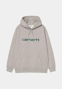 Sudadera gris de algodón, con un bolsillo frontal, capucha con cordón y un logo impreso de "carhartt." en color azul verdoso en el pecho.