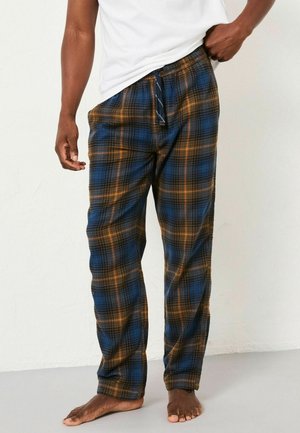 Cotton plaid pajama pants in blue, orange, and black. Features an elastic waistband with adjustable drawstring. Soft texture, loose fit.