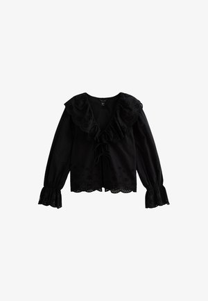 Blusa nera a maniche lunghe con scollo arricciato, parte anteriore con coulisse e ricami floreali intagliati lungo l'orlo e le maniche.