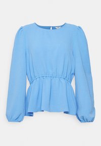 Modrá blůza s dlouhými rukávy, kulatým výstřihem, nařaseným pasem a volnými rukávy. Texturovaná látka s uvolněným střihem a peplum spodním okrajem.