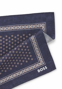 Navy blue patterned pocket square with a geometric design, beige accents, and white borders. Features "BOSS" logo in white.