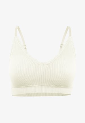 Heller beiger gerippter Bralette mit Spitzenbesatz entlang des Ausschnitts und der Träger, ausgestattet mit verstellbaren Trägern und einem nahtlosen, dehnbaren Design.