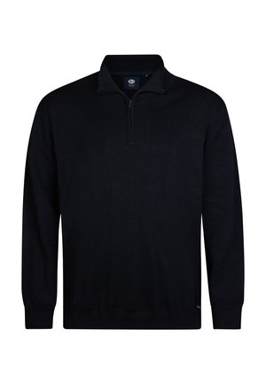 Zwarte ritstrui gemaakt van zacht breimateriaal. Beschikt over lange mouwen en een opstaande kraag met een discreet merkje aan de zoom.