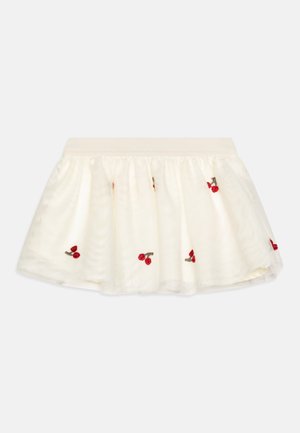 Vit kort kjol i lätt material, med röd körsbärsbroderi och en mjuk elastisk midja. Utsvängd A-linjeform.