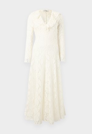 Long white lace dress with long sleeves, ruffled collar, fitted waist, and a flowing skirt on a plain background.