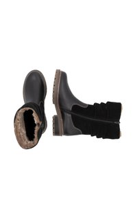 Zwarte laarzen met een combinatie van glad leer en zachte nubuck, met een met bont gevoerde binnenkant en een rits aan de zijkant. Robuuste zool voor grip.