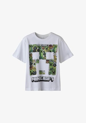Balts kokvilnas T-krekls ar krāsainu grafiku, kurā attēloti Minecraft varoņi un ikonas, apakšā ar treknu melnu tekstu "MINECRAFT".