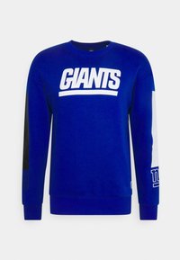 Blauwe sweatshirt van katoen, met witte "GIANTS" tekst over de borst, zwarte en grijze accenten op de mouwen, en ribgebreide manchetten.