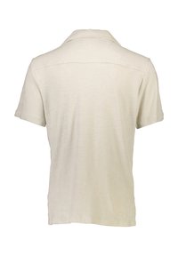 Polo shirt a maniche corte di colore crema realizzato in morbido tessuto, con colletto classico e una leggera trama, vista posteriore semplice.