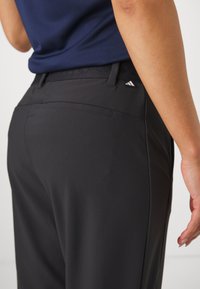 adidas Golf UTIMATE365 TOUR TWISTKNIT PANTS - Auduma bikses - black