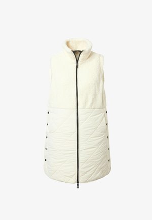 Kremowa kamizelka z wysokim kołnierzem, z puszystą górną częścią i pikowaną dolną. Szeroki zamek błyskawiczny z przodu i zatrzaski wzdłuż lewego boku.