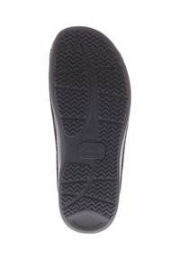 Zwarte schoenzool met een gestructureerd grippatroon, voorzien van zigzagprofielen en een glad gedeelte bij de hak. Inclusief logo-detail "Finn Comfort".
