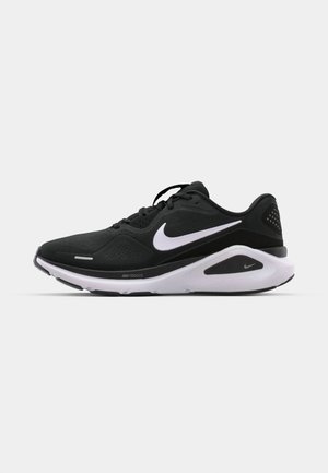 Nike running shoe featuring a black mesh upper, white accents, a cushioned sole, and a streamlined design for comfort and support.