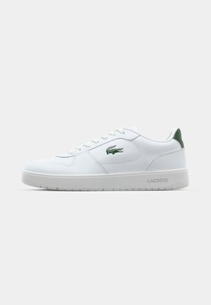 Hvite lær sneakers med gummisåle, grønn hælakkent og en liten grønn logo. Har teksturerte sidepaneler og runde snører.
