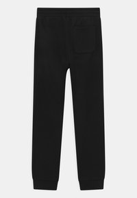 Calvin Klein Jeans LOGO PIPING - Teplákové kalhoty - black