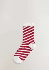 Piros-fehér csíkos zokni puha, bolyhos anyagból. Lekerekített orr-rész és fehér szegély a felső részen, váltakozó vastag csíkokkal.