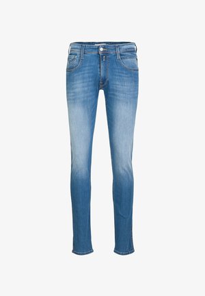 Schmale Jeans in hellblauem Denim. Ausgewaschene Optik, Fünf-Taschen-Design mit sichtbaren Nähten, Metallknopf und Reißverschluss.