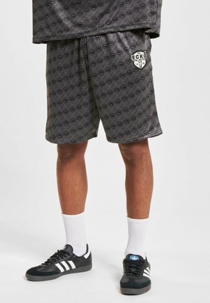 LOGO MANIA  - Tracksuit bottoms - black grey
