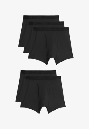 Boxer neri in cotone, con una cintura decorata con logo, texture liscia e un design tradizionale con apertura a patta. Set di tre.