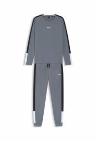 Grau meliertes Sportoutfit bestehend aus einem Langarmoberteil mit schwarzen und hellblauen Akzenten sowie passenden Hosen, beide mit lässiger Passform und Logodetail.