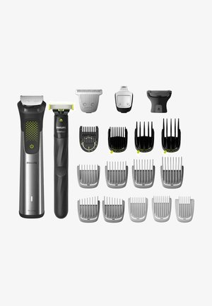 Das Philips Pflege-Set enthält einen silbernen und schwarzen elektrischen Haarschneider mit mehreren Aufsätzen, die verschiedene Längen und Detail-Schneidköpfe bieten.