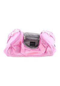 Pink duffel bag made of durable fabric, featuring dual zippered compartments, a gray interior lining, and padded handles for easy carrying.