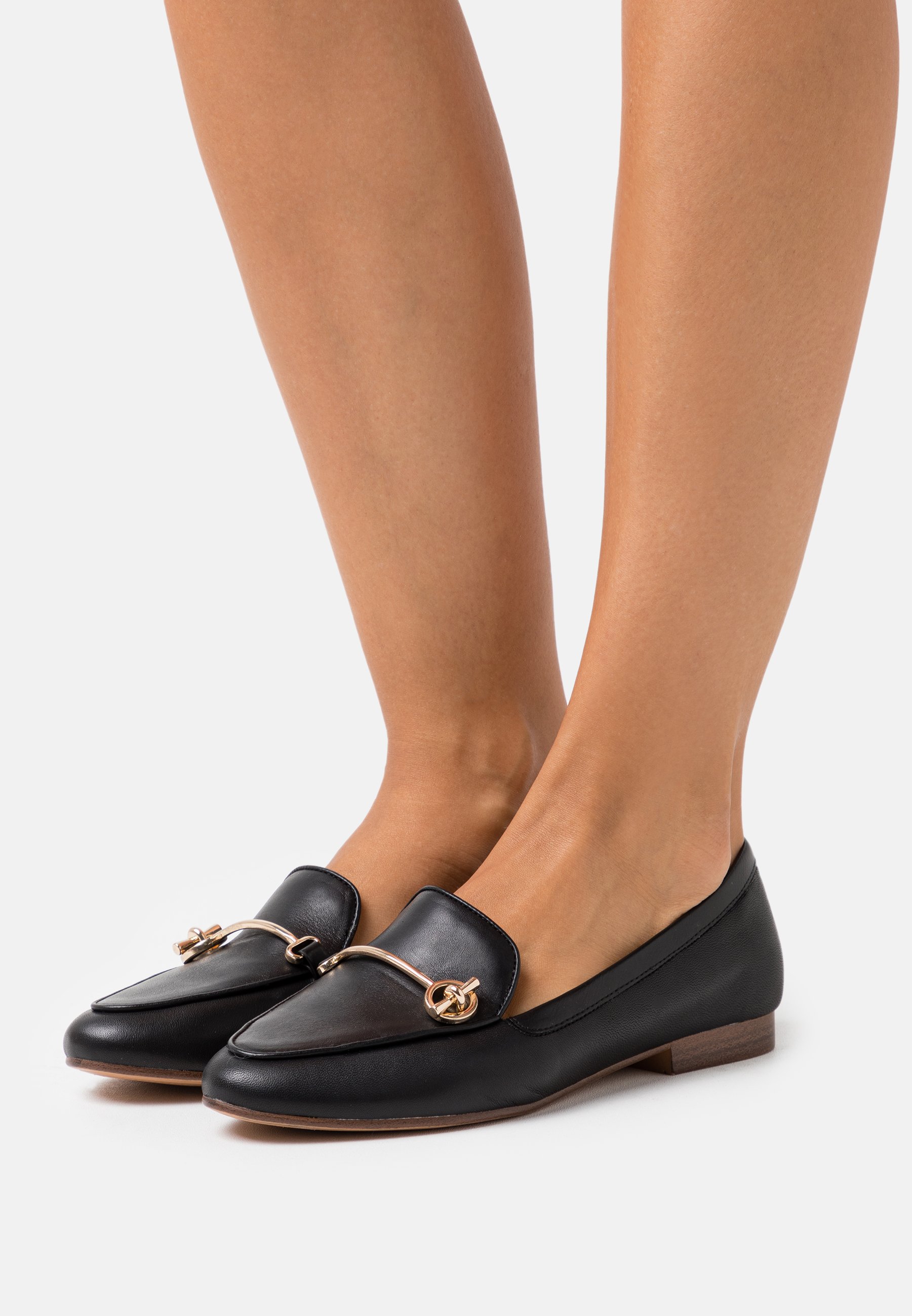 aldo black slip ons