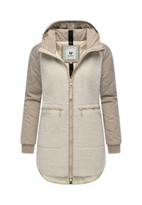 Creme- og beige hættejakke med fleece-for, quiltede ærmer, to lynlåsede lommer og lynlås i fuld længde. Blød tekstur, varm design.