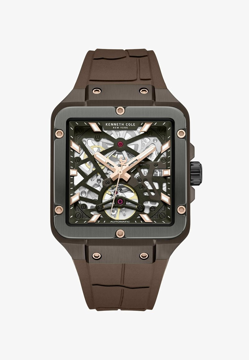 Vierkante automatische horloge met een bruine siliconen band, een zwart en zilveren skelet-dial, rosegouden accenten en mineraalglas.